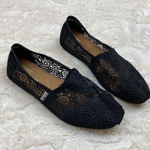 TOMS classic black floral lace slip-ons